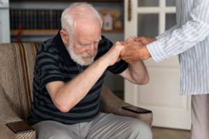 A nurse is holding patient 's hand