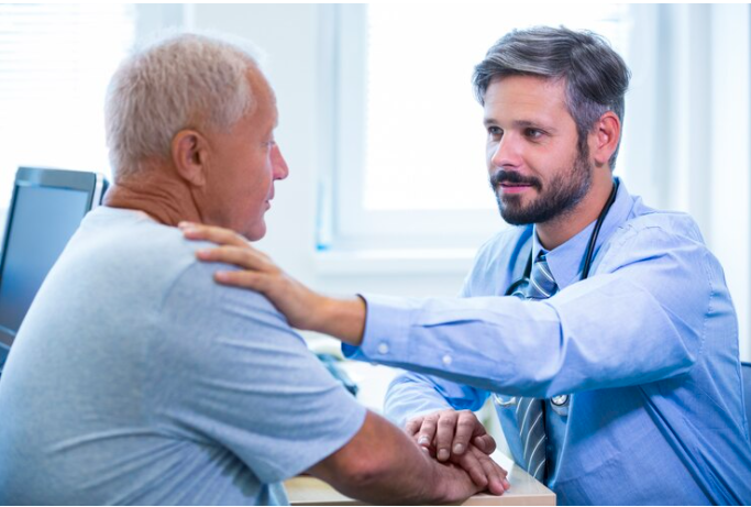 Male doctor examining a patient